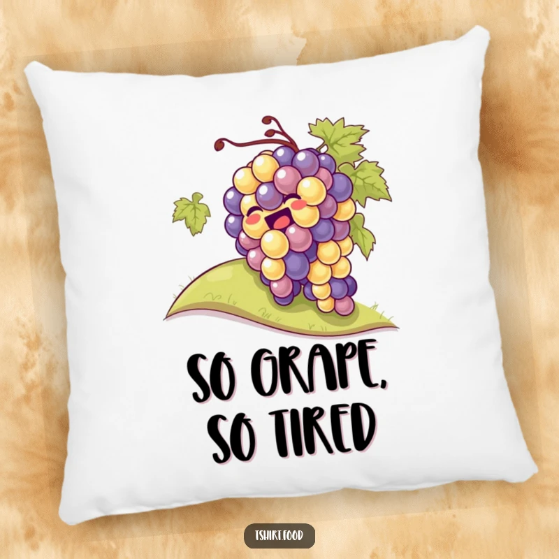 A soft pillow featuring a giggling bunch of grapes rolling down a hill, ideal for cozying up with laughter.