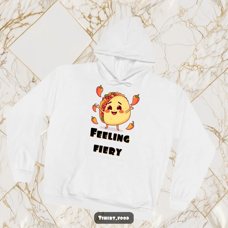 Funny Hoodie: A determined taco character enthusiastically juggles tiny peppers, radiating warmth and a spicy sense of humor.