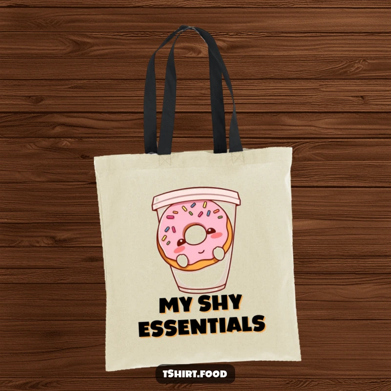 Funny shy donut tote bag featuring a blushing donut with sprinkles hiding behind a coffee cup, a charming and humorous accessory.